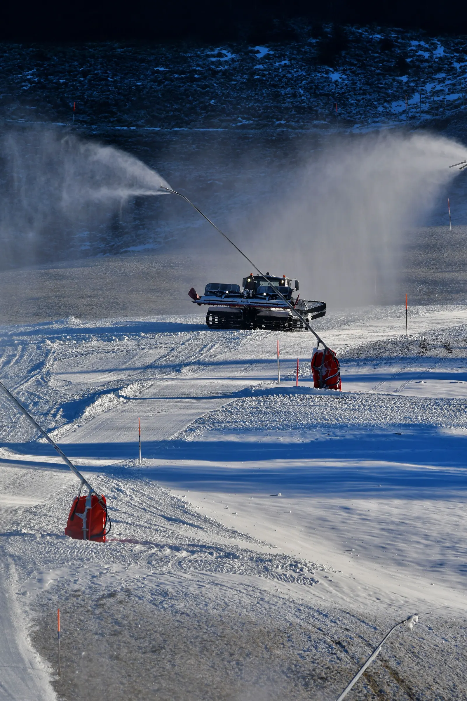 Snow groomers out at night