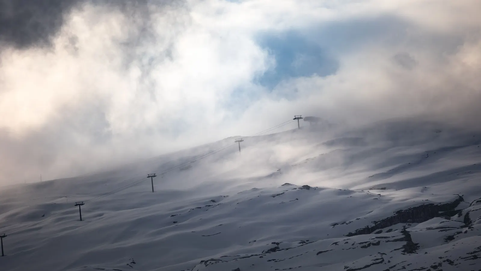 Snow mist falling on mountain