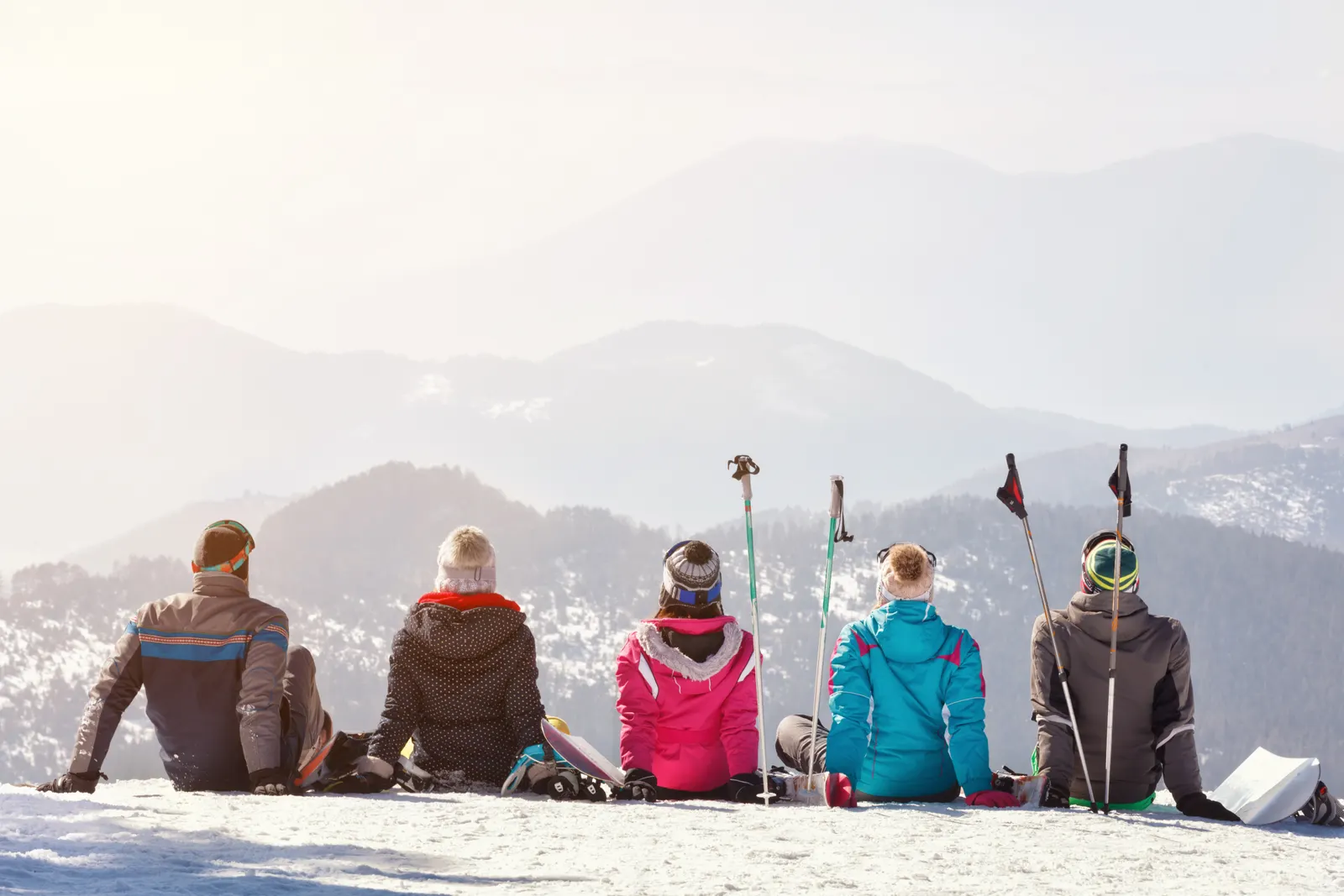 Skiers lined up at top of mountain